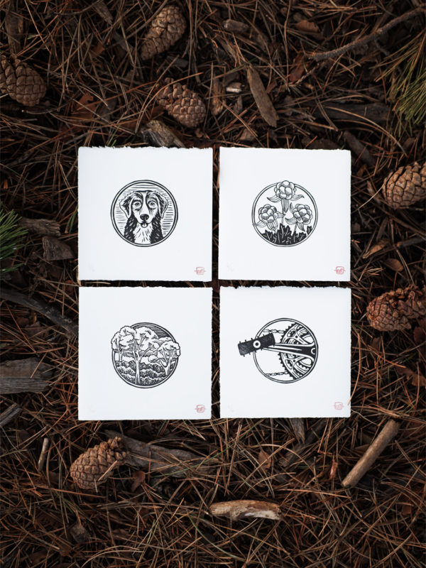 Four linocut icon prints on paper by artist Sarah Finger